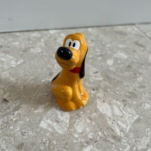 Pluto porcelain figure